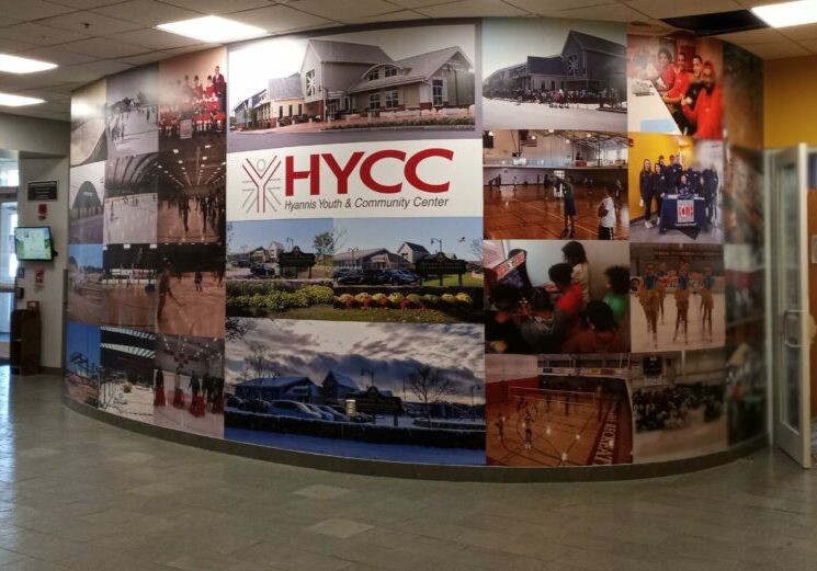 HYCC Lobby displaying colorful photos of activities and community groups