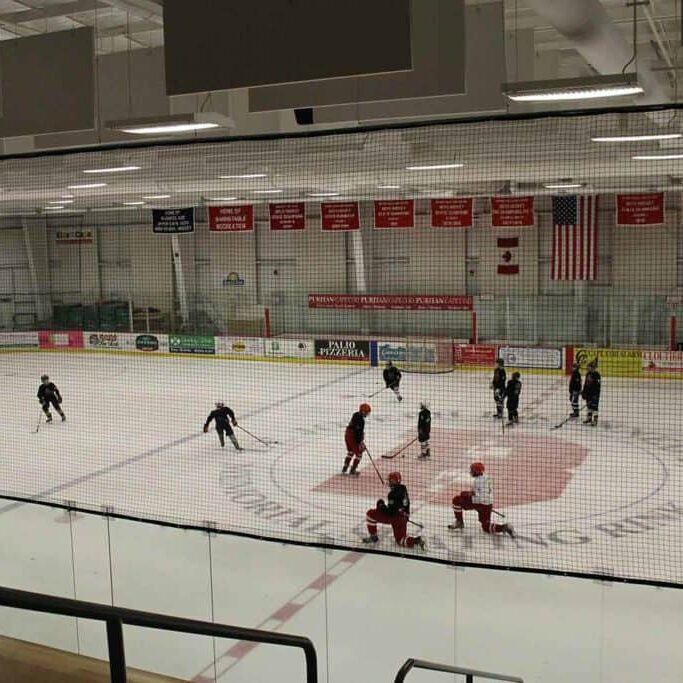 Patrick Butler rink with open hockey practice in session showing several teen hockey players on the ice